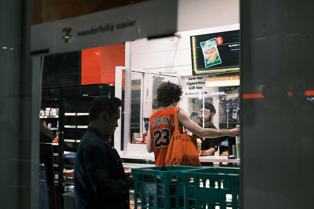 store security guard monitoring shoppers