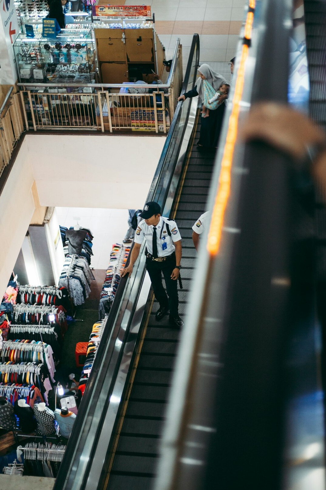 store security guard monitoring shoppers