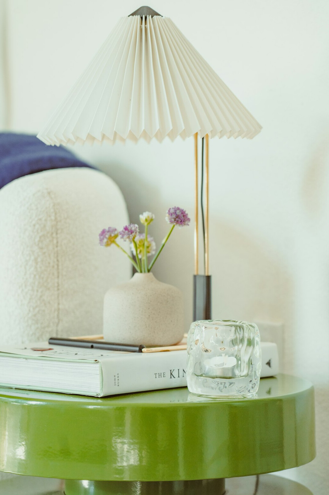 Reading room with green lamp and open book