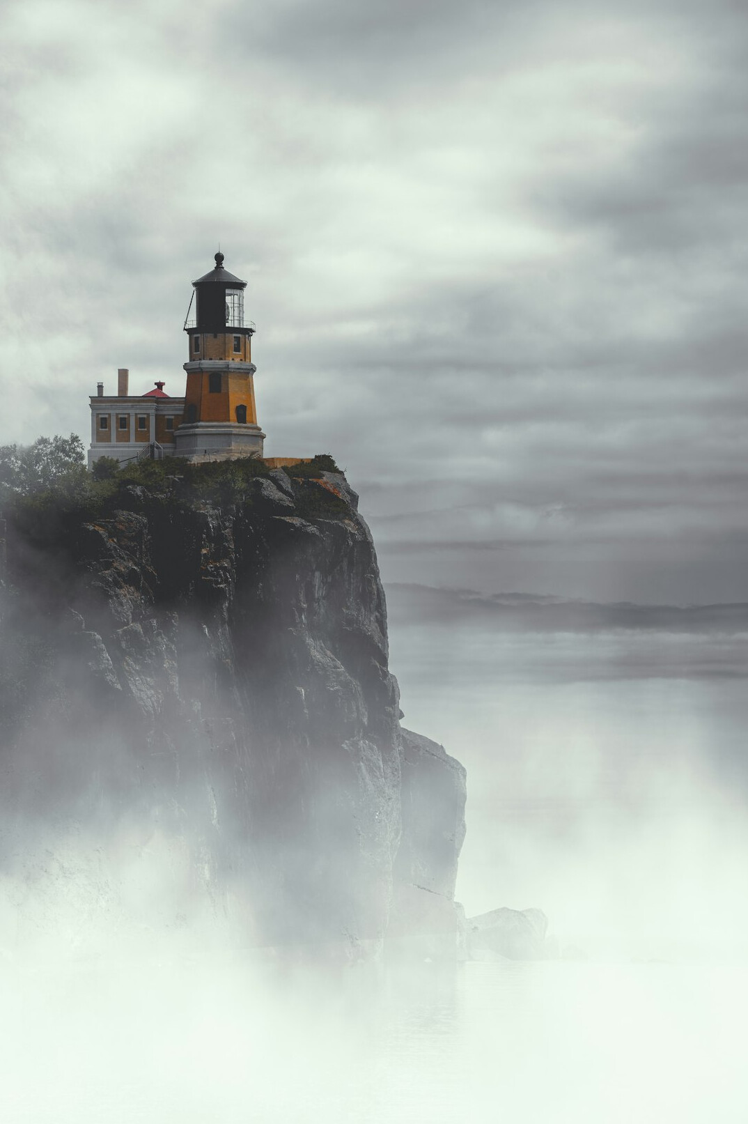 Foggy coastal lighthouse near Punta del Este at dawn