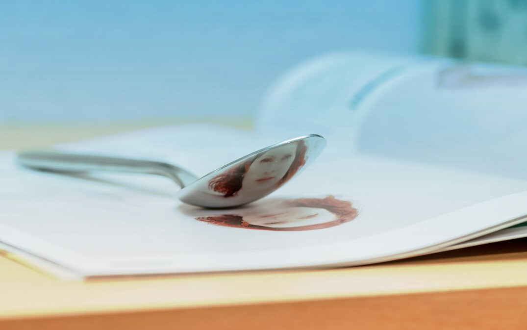 Magnifying glass resting on top of old documents